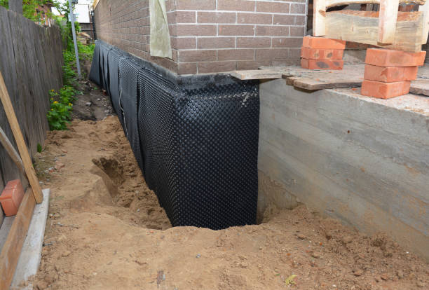 SJ Waterproofing Pros technician performing targeted Emergency Waterproofing assessment in Clio, MI